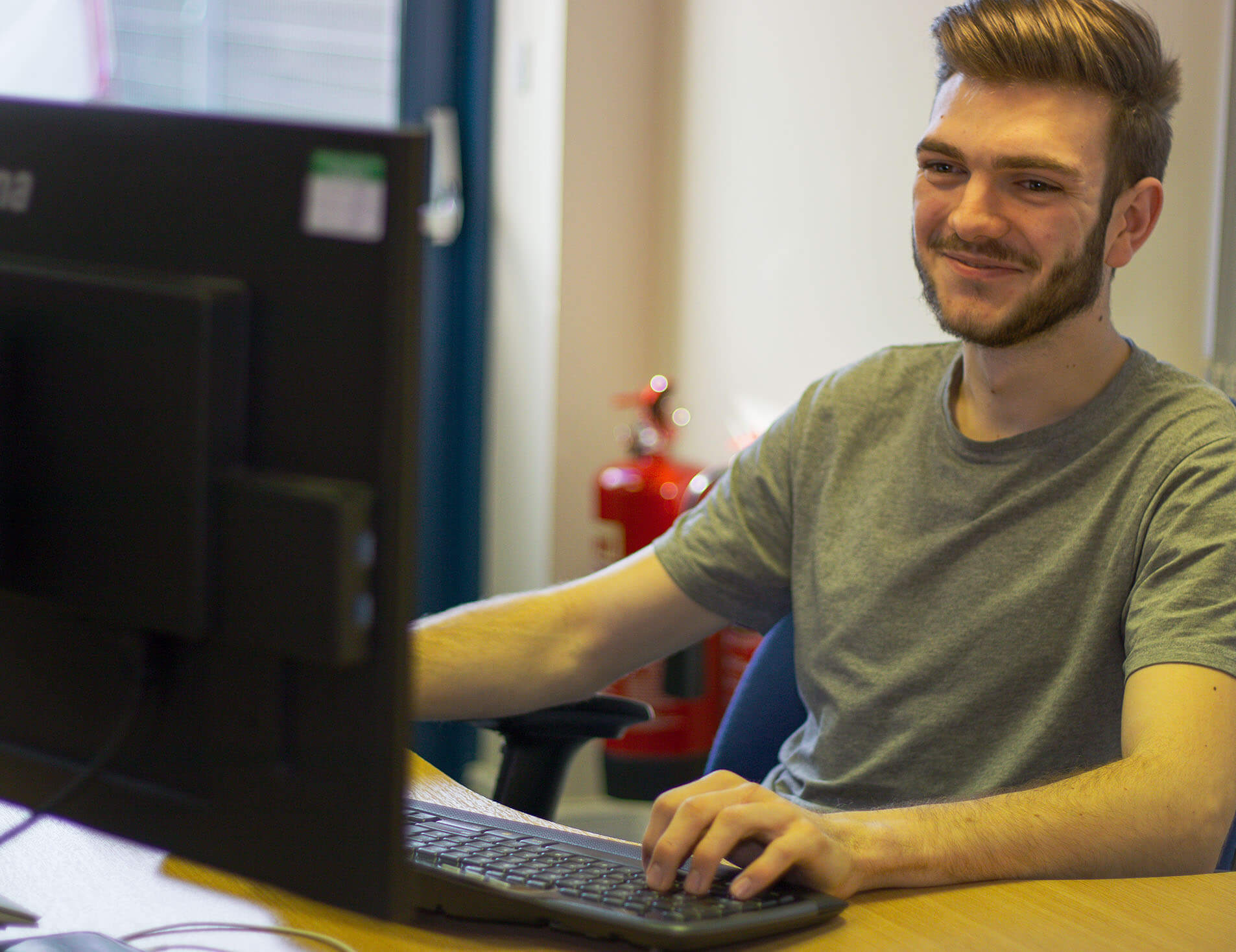 Breyer IT apprentice working at his desk