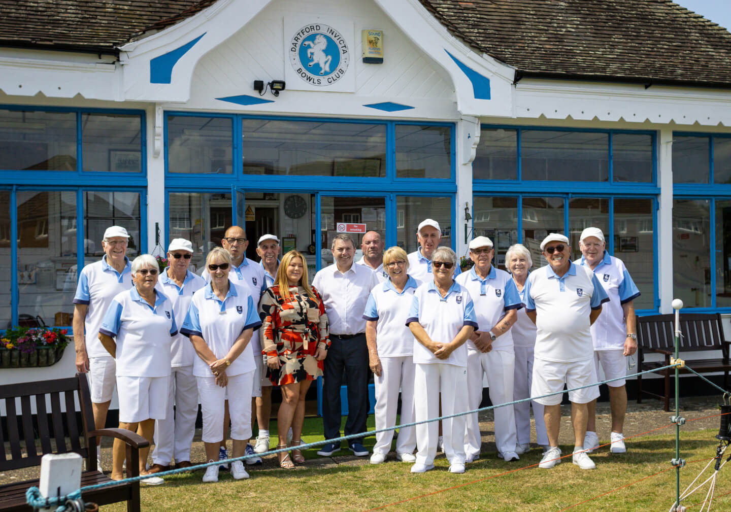 Dartford bowls club members standing infant of their club with the local MP and Social Value Manager for Breyer Group