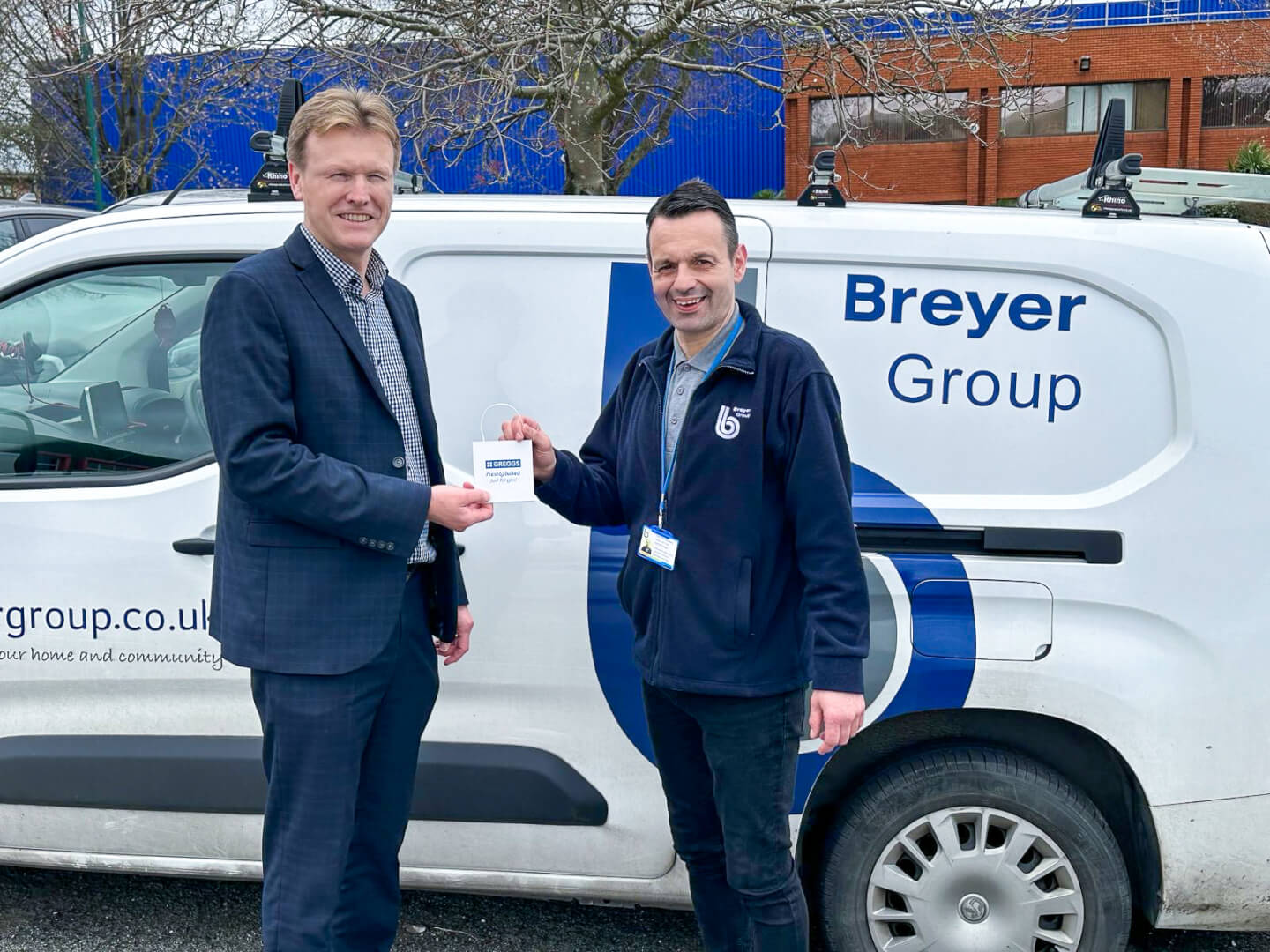 Commercial Director, Mark Crane, handing over a voucher to the first of our monthly winners